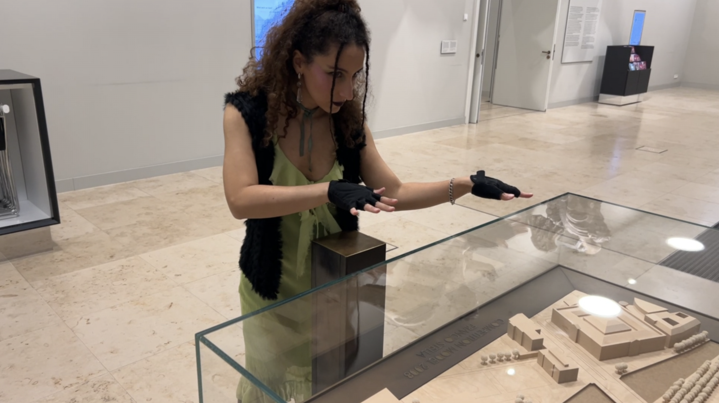 Woman interacting with architectural model